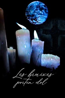 Lit candles in front of a Christian cross, under a full moon.