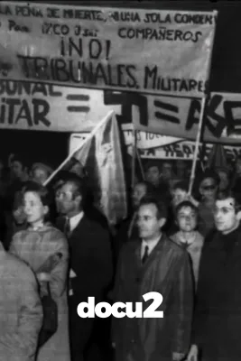 Black-and-white photo of a protest with banners against military tribunals.